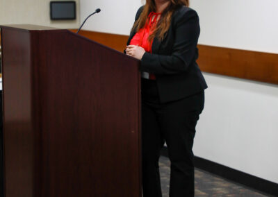 Student stands at podium during her chemistry talk